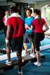 Photo: Fit people working out in fitness centre Fit people working out in fitness centre