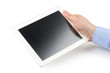 Man's right hand holding a tablet computer.