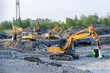 Several excavators on construction site