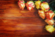 Corner Made of Roses Over a Wooden Background