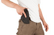 Close-up of a man with his hand on a gun