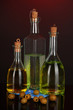 Original glass bottles with oil on dark color background