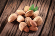 Foto: Almond nuts with leaves. Almond nuts with leaves.