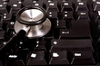 Stethoscope and computer keyboard