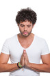 Young man with hands in prayer