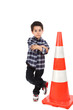 Young boy with cone road signal