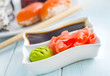 ginger, vasabi and soy sauce in white bowl