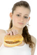 Photo: Schülerin schaut angewidert auf Cheeseburger Schülerin schaut angewidert auf Cheeseburger