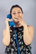 Smiling Young Woman with Phone Receiver