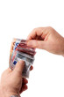 Hands holding banknotes