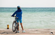 Girl With A Bicycle Stands On ... Girl With A Bicycle Stands On ...