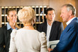 Photo: Reception - Guests check in a hotel Reception - Guests check in a hotel