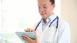 Doctor using app on a tablet computer