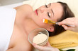 Beautiful young woman in cosmetic salon close up