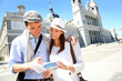 Tourists standing by the Almudena Cathedral of Madrid