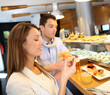 Couple in Madrid eating Spanish savouries