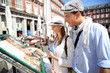Couple of tourists reading Spanish restaurant menu
