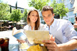 Tourists in Madrid reading city map