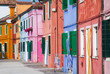 Photo: Sunny street with colourful buildings in Burano, Italy. Sunny street with colourful buildings in Burano, Italy.