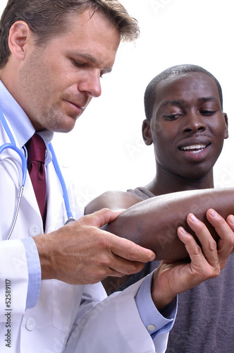 Photo: Elbow injury examination Elbow injury examination