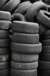 Old used stacked tires. Vertical background texture
