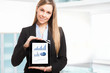 Businesswoman showing business diagrams on a tablet