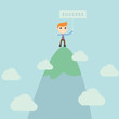 Businessman standing on high mountain