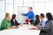 Businessman Conducting Meeting In Boardroom