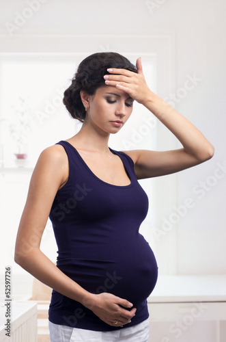 Photo: Pregnant woman with headache Pregnant woman with headache