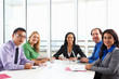 Businesswoman Conducting Meeting In Boardroom