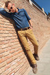 casual man standing by wall