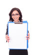 Photo: business woman showing clipboard business woman showing clipboard