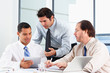 Group Of Businessmen Meeting In Office