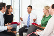 Businesspeople Having Informal Office Meeting