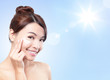 Photo: Beautiful woman face with sunshine and sky Beautiful woman face with sunshine and sky