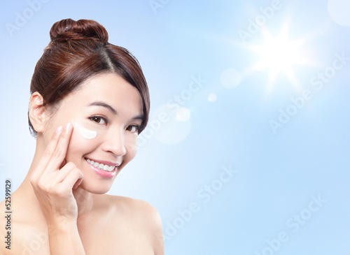 Photo: Beautiful woman face with sunshine and sky Beautiful woman face with sunshine and sky