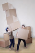 Asian couple moving boxes