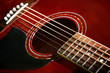 Red Acoustic Guitar Close-up
