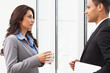Businesspeople Having Informal Meeting In Office
