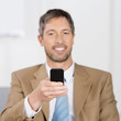 Photo: geschäftsmann mit handy geschäftsmann mit handy