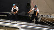 Photo: Two Climbers Working on Heights Two Climbers Working on Heights