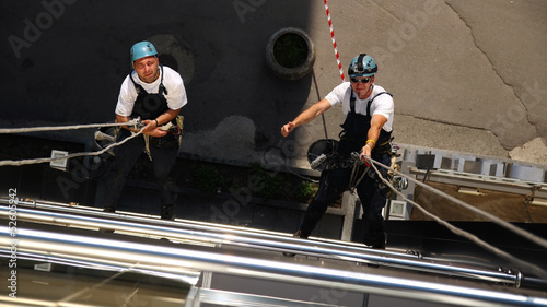 Photo: Two Climbers Working on Heights Two Climbers Working on Heights