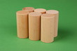 wooden geometric shapes on a green background