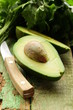 ripe avocado cut in half on a wooden table