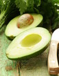 ripe avocado cut in half on a wooden table