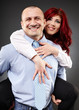 Businessman carrying his partner in the back