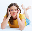 Portrait of smiling young woman lying on floor