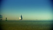Boats sailing at sunset, zoom out