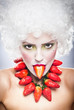 Creative makeup beauty shot of model with strawberries,artistic