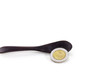 Ten baht Thailand coin on wooden spoon